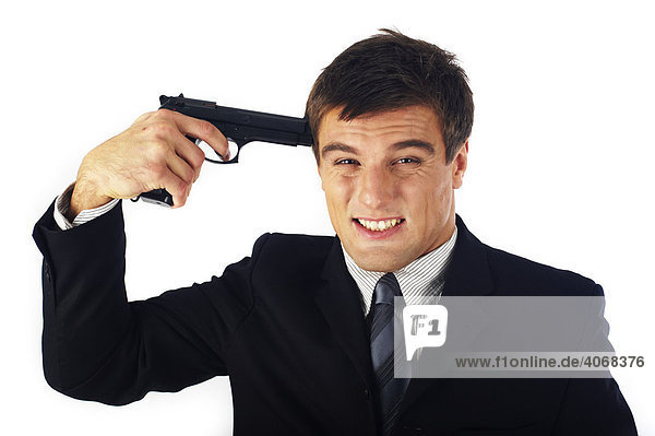 Businessman pointing gun to his head