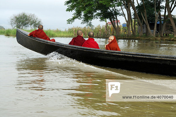 Four monks in a boat  Inle Lake  Myanmar  Burma  South East Asia