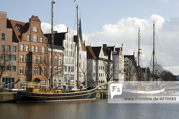 View of the hanseatic city of Luebeck with traditional sailing boats on the Trave River  Luebeck  Schleswig-Holstein  Germany  Europe