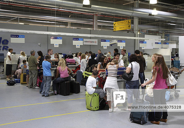 Passengers waiting at the check-in counter  Frankfurt/Hahn Airport  Lautzenhausen  Rhineland-Palatinate  Germany  Europe