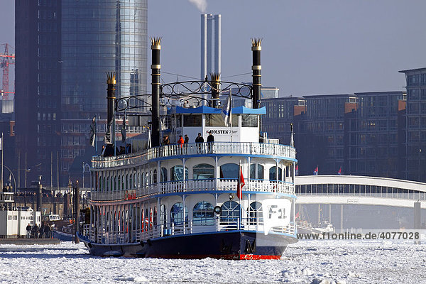 Paddle wheel steamer  Louisiana Star  in winter in the icy waters of the Elbe River in front of HafenCity with the Hanseatic Trade Centre  Hamburg harbour  Hamburg  Germany  Europe