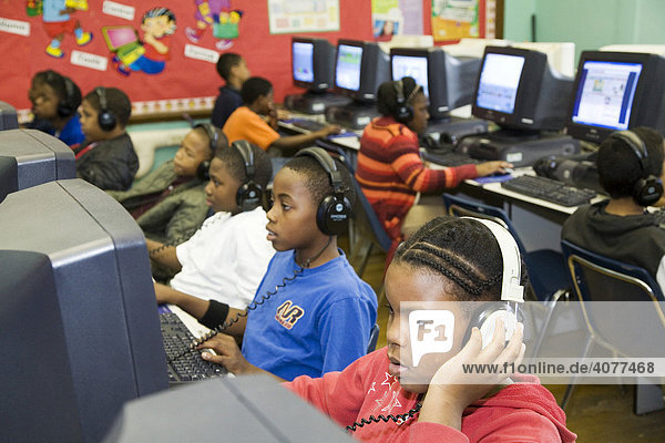 Fourth grade students in the computer lab at Guyton Elementary School  Detroit  Michigan  USA
