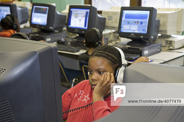 Fourth grade student in the computer lab at Guyton Elementary School  Detroit  Michigan  USA