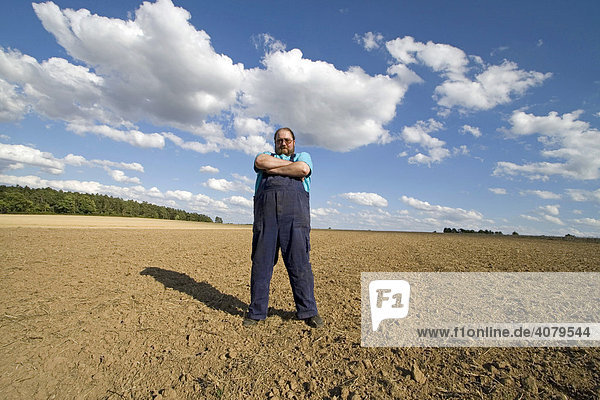 Farmer standing in a field