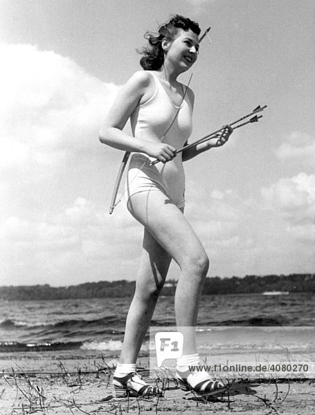 Historical image  female archer  ca. 1940