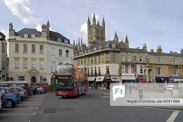 Open-top double decker sightseeing bus in front of Bath Abbey  Bath  Wessex  England  UK