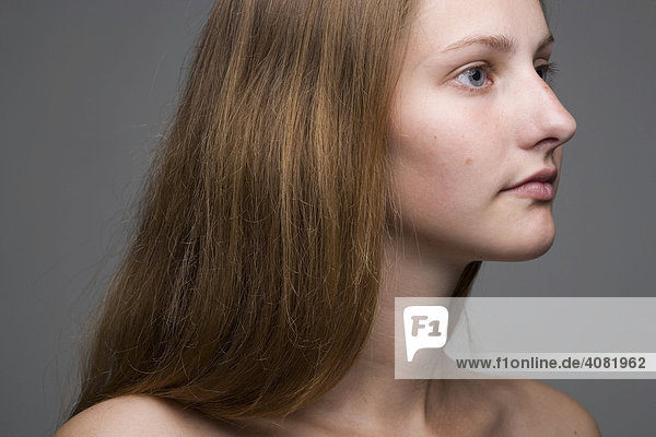 Portrait of long-haired woman  profile
