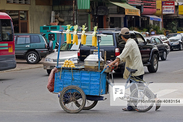 Corn vendor walking the streets with his cart  Phnom Penh  Cambodia  Southeast Asia
