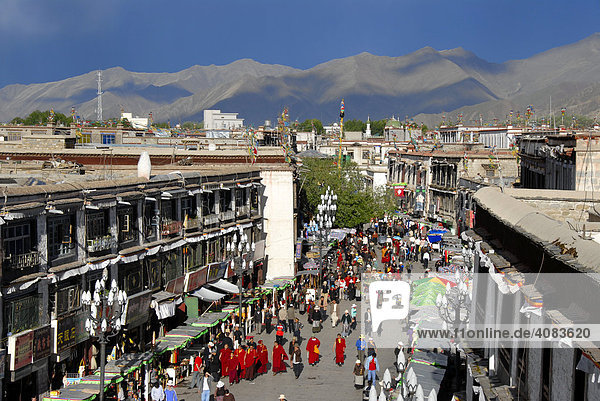 View from above Tibetan pilgrims and monks at the Kora around the Jokhang Temple Lhasa Tibet China