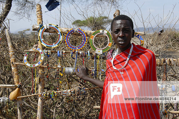 Masai woman sells colourful jewelry in the kraal Ngorongoro Conservation Area Tanzania