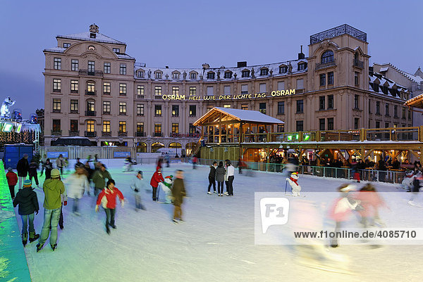 Karlsplatz Stachus ice-skating on a artificial scating ring Munich Upper Bavaria Germany