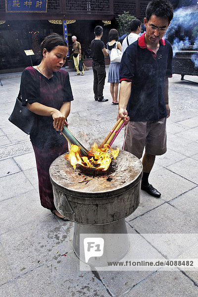 City God Temple  believers lighting joss sticks  old part of town  Shanghai  China  Asia