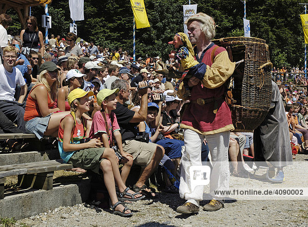 Puppet player with punch passes by grand-stand  knight festival Kaltenberger Ritterspiele  Kaltenberg  Upper Bavaria  Germany