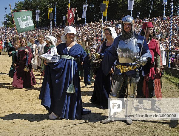 Knights in mediaeval medieval costumes at move-in of comedians in arena  knight festival Kaltenberger Ritterspiele  Kaltenberg  Upper Bavaria  Germany