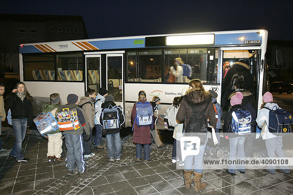 DEU  Federal Republic of Germany  Viernheim  pupils enter their school bus in the morning