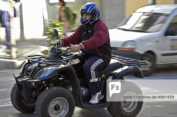 Man driving on Quad  motorcycle  Calpe  Costa Blanca  Spain