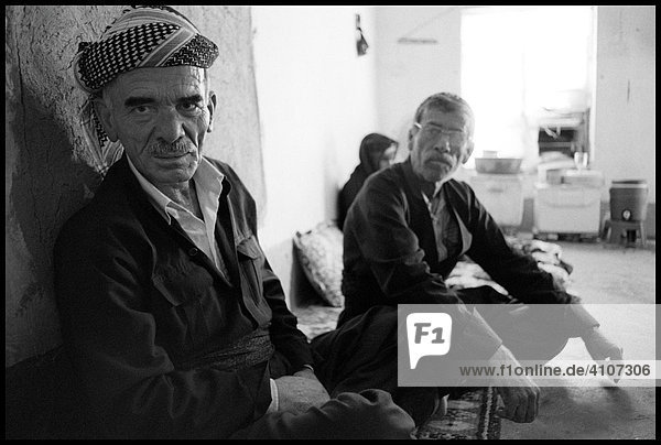 Kurdish mayor of Qarradarra with friend in living room