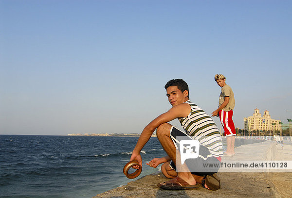 Boy fishing  Malecón  Cuba  Caribbean  Americas