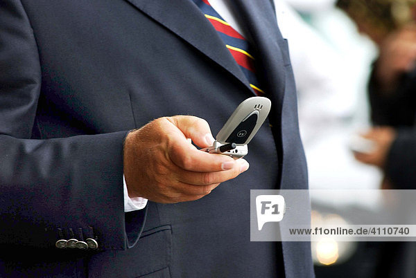 Business man works with his Motorola mobile phone