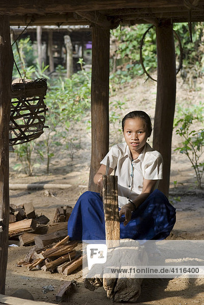 Girl hacking fire wood  refugee camp Ei Tu Hta  IDP-Area bordering Thailand near Mae Sariang  Birma