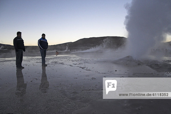Two men at the Tatio geysers  Atacama desert  northern Chile  South America