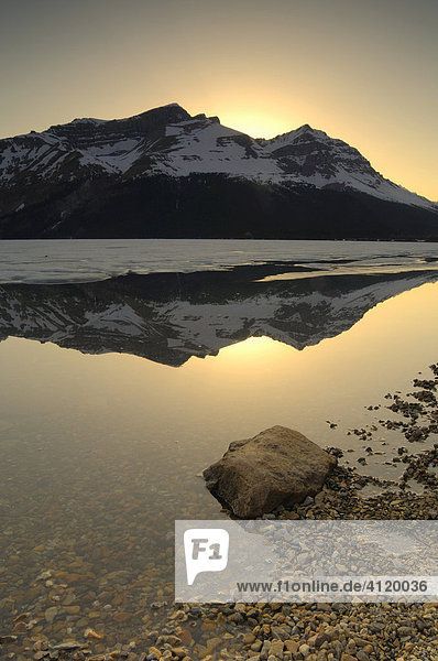 Sunset on frozen Bow Lake along the Icefields Parkway  Banff National Park  Alberta  Canada