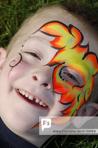 Young boy with artistic face painting