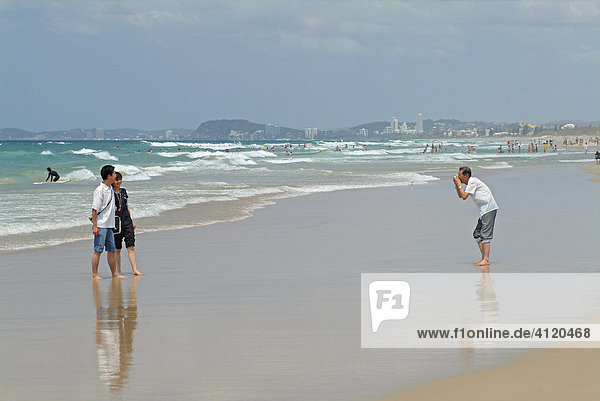 Tourists  taking pictures at Surfers Paradise beach  Queensland  Australia