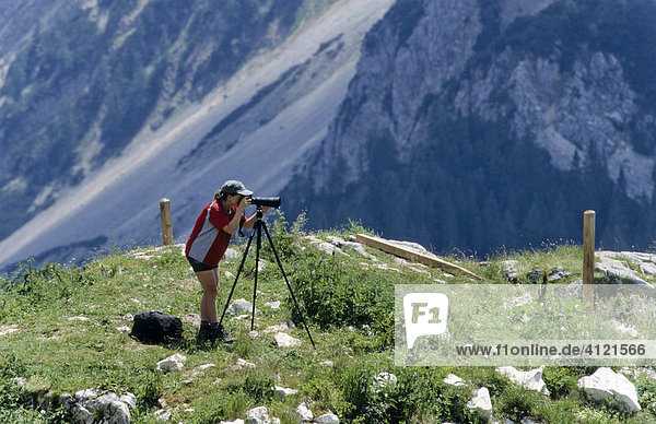 Female photographer using a tripod  Lechtal Alps  Tyrol  Austria  Europe