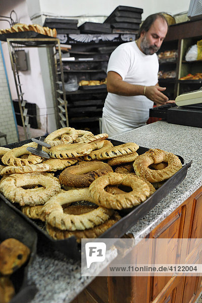 Stuffed sesam pastry at a bakery in the old town  Myconos  Greece
