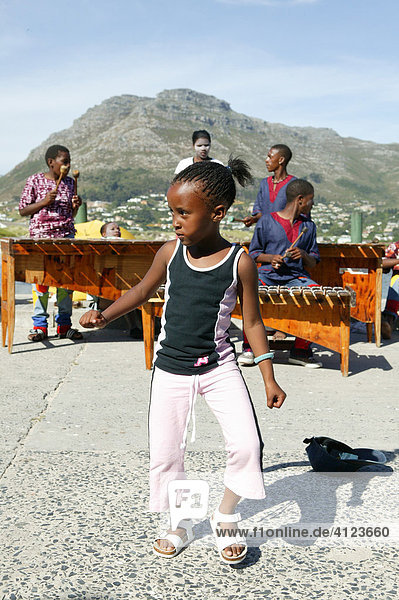 Street musicians with dancing child  Marimba Band  Hout Bay  Cape Town  West Cape  South Africa