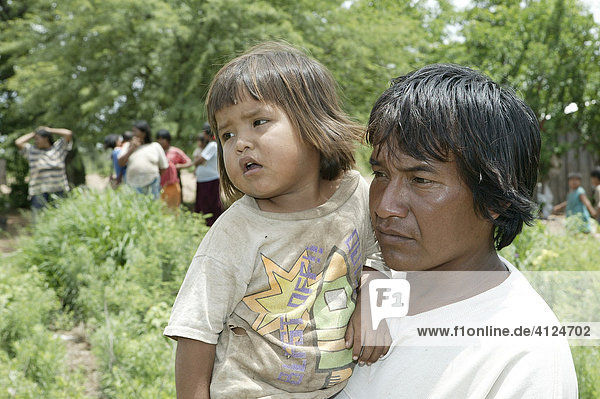 Father with child on his arms  Nivaclé Indians  Jothoisha  Chaco  Paraguay  South America
