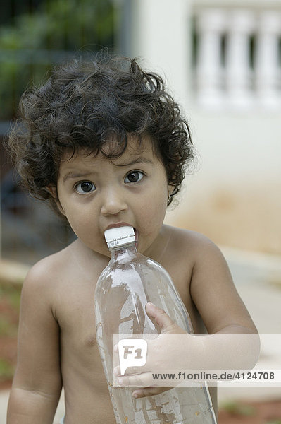 Teething toddler with water bottle  Asuncion  Paraguay  South America