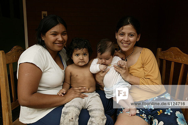 Two mothers with their children  toddler and baby  Asuncion  Paraguay  South America