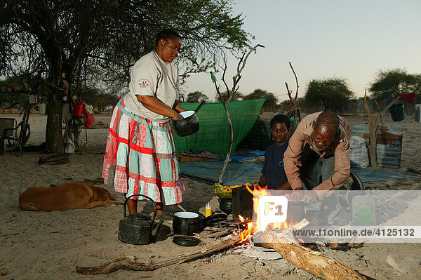 Two women cooking at the campfire  Cattlepost Bothatogo  Botswana  Africa