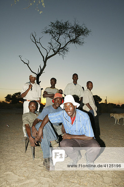 Group of community men gathering under the village tree  Sehitwa  Botswana  Africa