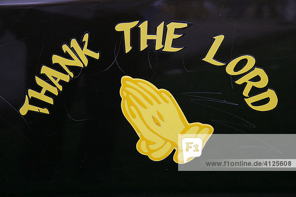 Praying hands and slogan Thank the Lord on a car door in Georgetown  Guyana  South America