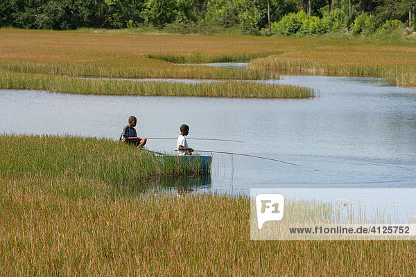 Children fishing in Lake Capoey  Guyana  South America