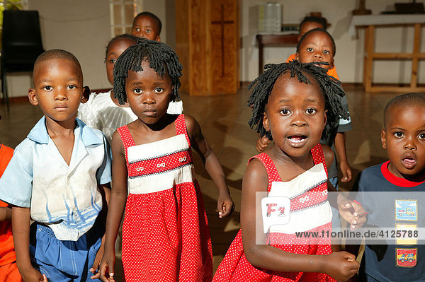 Children  twins singing and dancing at a kindergarten  Gaborone  Botswana  Africa