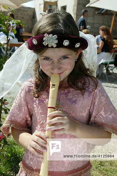 Girl playing recorder during a medieval festival  Burghausen  Upper Bavaria  Bavaria  Germany  Europe