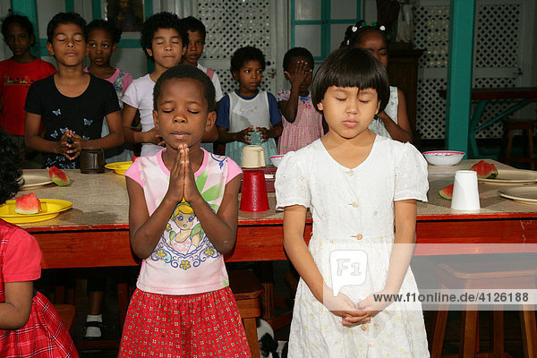Prayers before a meal  everyday life at an Ursuline convent and orphanage  Georgetown  Guyana  South America