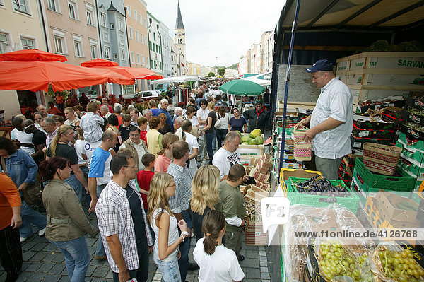 Fruit vendor at a market stand  Simonis Market  Muehldorf am Inn  Bavaria  Germany