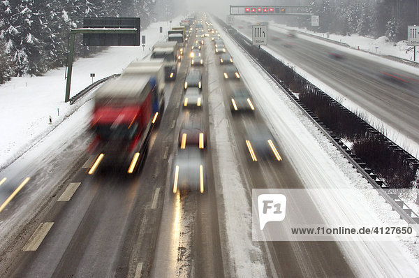 Highway at wintry road conditions traffic jam on the higway