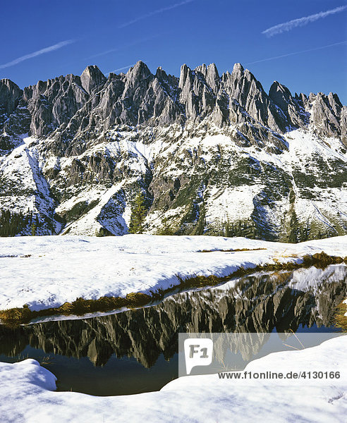 Hochkoenig Massif reflected on the surface of a mountain lake  Berchtesgadener Alps  Salzburger Land  Austria  Europe