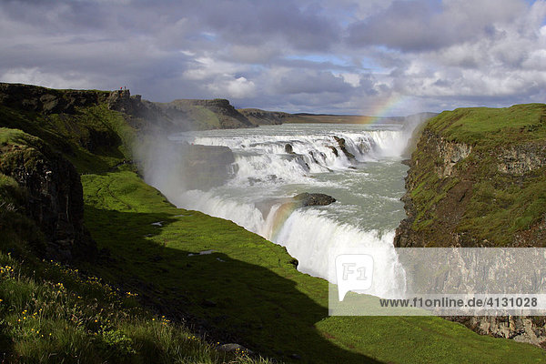 Gullfoss-Waterfall at the Hvita-River near by the Langjoekull-Glacier in Iceland with rainbow in the evening light Golden Waterfall Iceland