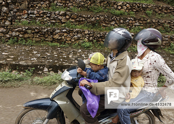 Family on moped  Yen Chau  Vietnam  Asia