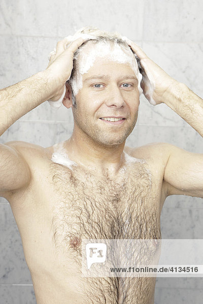 Hairy man showering  washing his hair