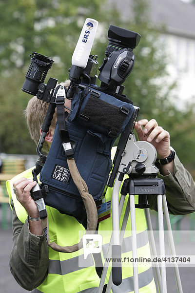 Cameraman with videocamera
