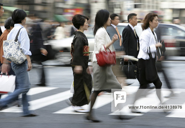 Pedestrians on a crosswalk in Ginza Tokyo Japan