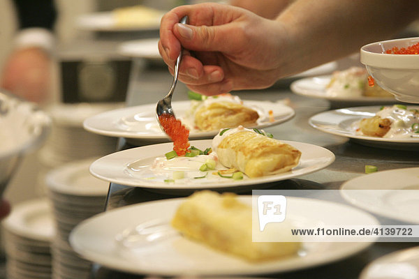 Preparing a seafood-in-filo-pastry dish at a restaurant kitchen in Germany  Europe